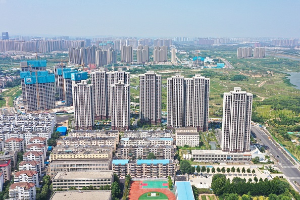This aerial photo taken on August 14, 2023 shows buildings of China's developer Country Garden Holdings in Zhengzhou, in China's central Henan province. Concerns are mounting in China around Country Garden, a major property developer whose colossal debt raises fear of a bankruptcy that could spell wider economic turbulence, two years after the unravelling of its competitor Evergrande. Country Garden shares plunged by more than 16 percent in Hong Kong on August 14, 2023, after it missed bond payments and warned of multibillion-dollar losses. (Photo by AFP) / China OUT (Photo by STR/AFP via Getty Images)