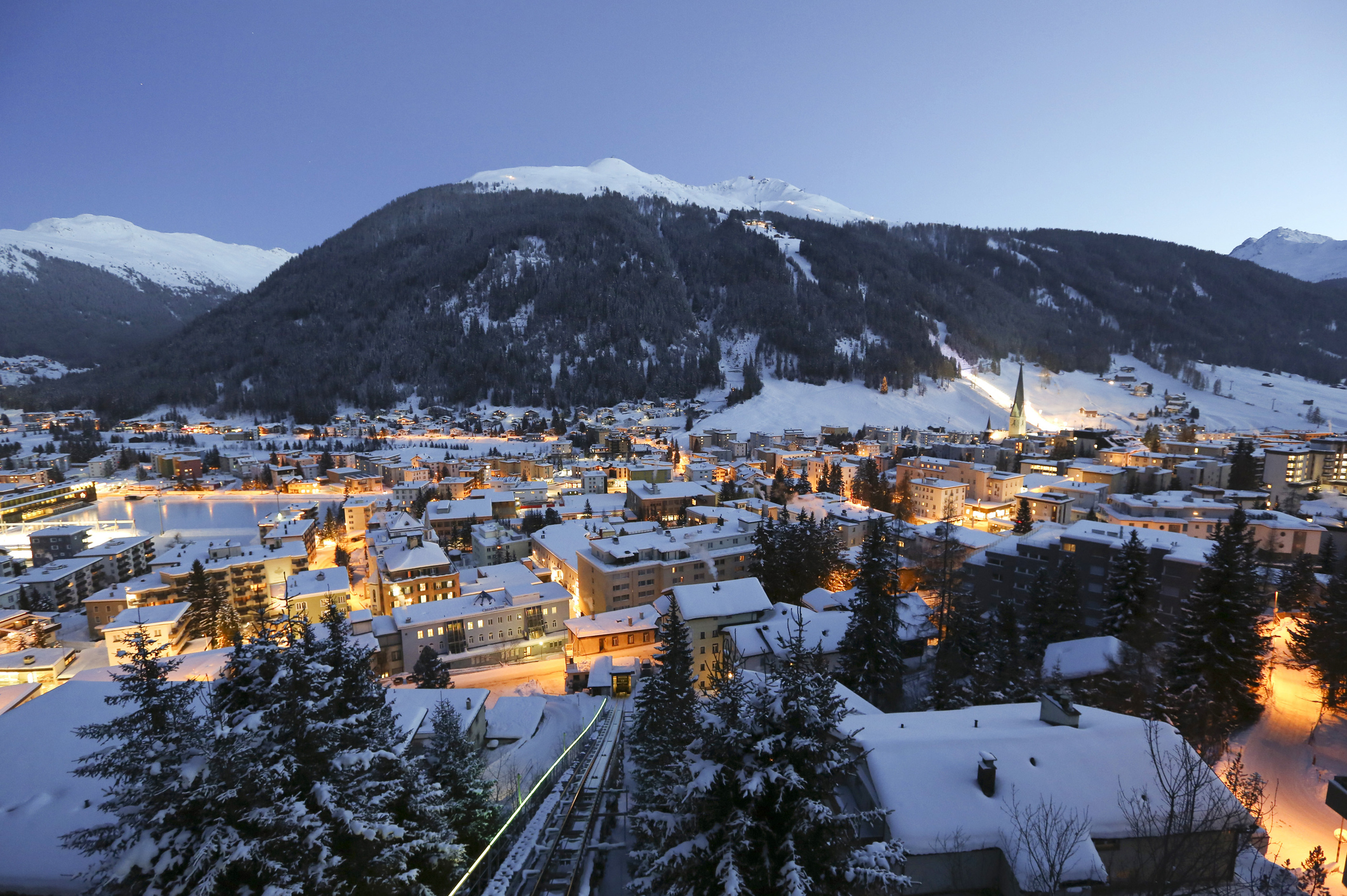 Snow covered buildings from the Schatzalp area above the town of Davos, Switzerland. Photographer: Chris Ratcliffe/Bloomberg