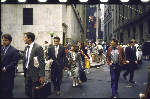 Wall Street workers heading home after the stock market crash.    (Photo by Bill Foley/Getty Images)